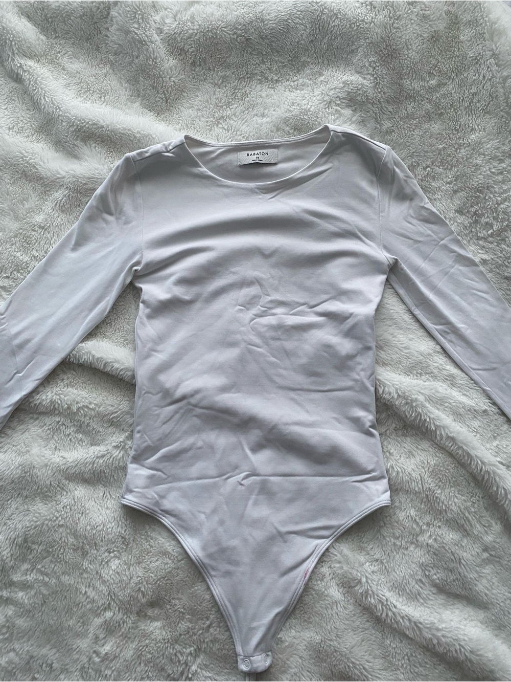 Babaton White Long-Sleeve One-Piece Bodysuit